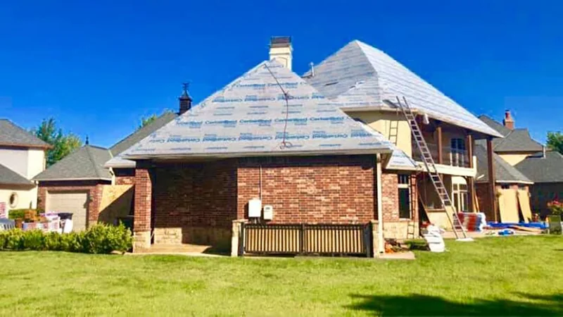 Brick home with roofing underlayment installed during replacement