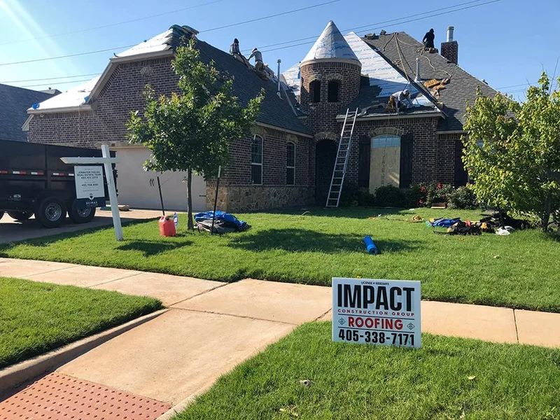 Large home undergoing a complete roof replacement