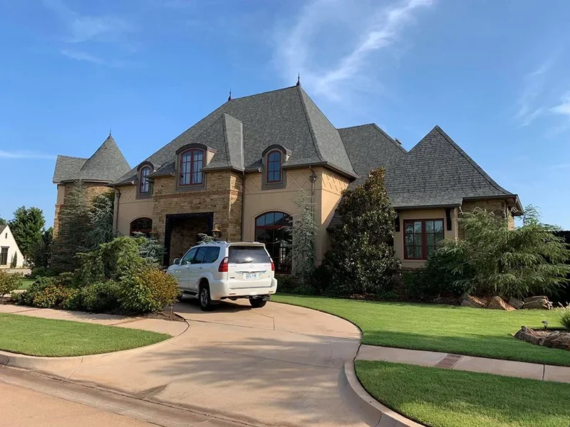 Large home with a completed architectural shingle roof