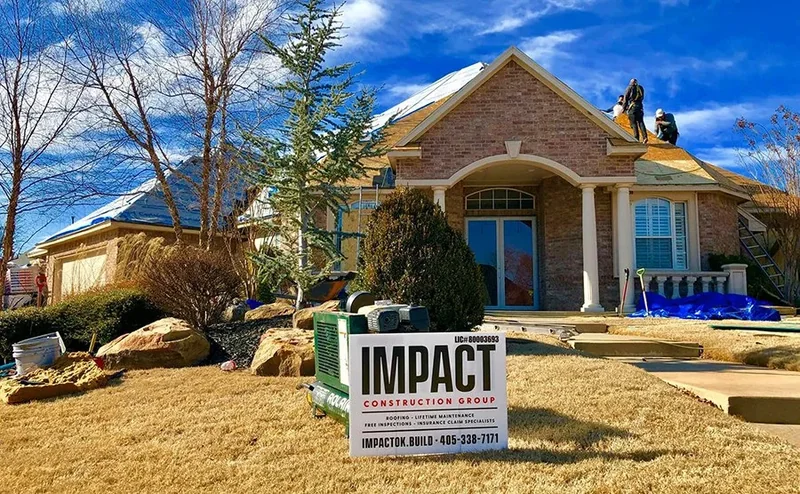 Roofing materials staged beside a home during replacement