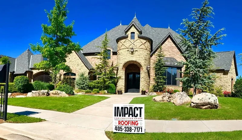 Stone and brick home with a completed architectural shingle roof