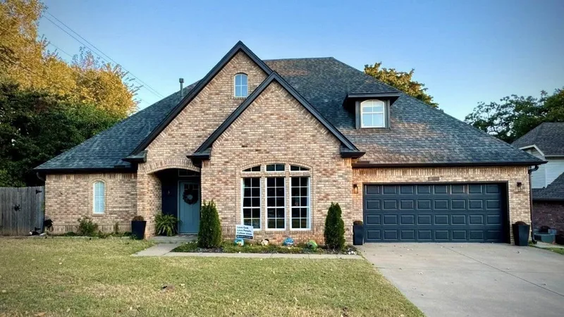 Brick home with a completed architectural shingle roof