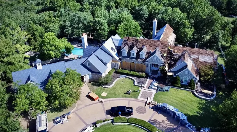 Aerial view of a large estate during a roof replacement